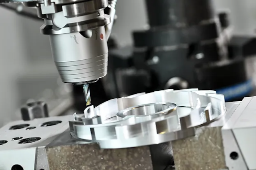 High-speed 3-axis custom CNC machining milling an aluminum gear component with precision.
