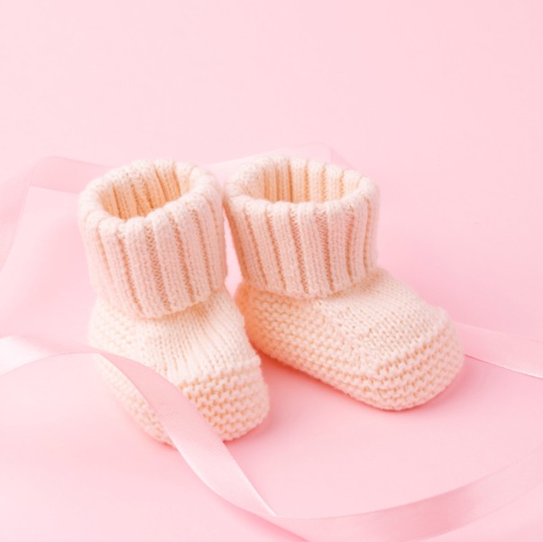 Knitted baby booties produced by Indian babywear manufacturers for UK brands