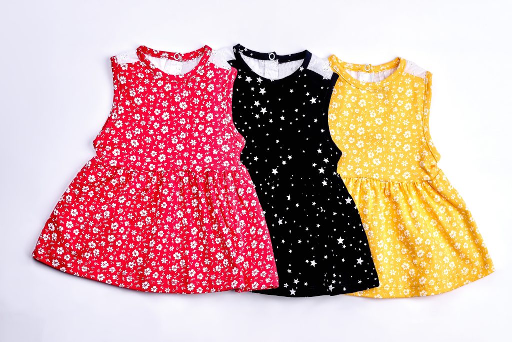 Printed children’s dresses manufactured by Indian clothing manufacturers. A set of printed children’s dresses in vibrant colours, showcasing the design range, print capability, and production consistency offered by Indian clothing manufacturers.