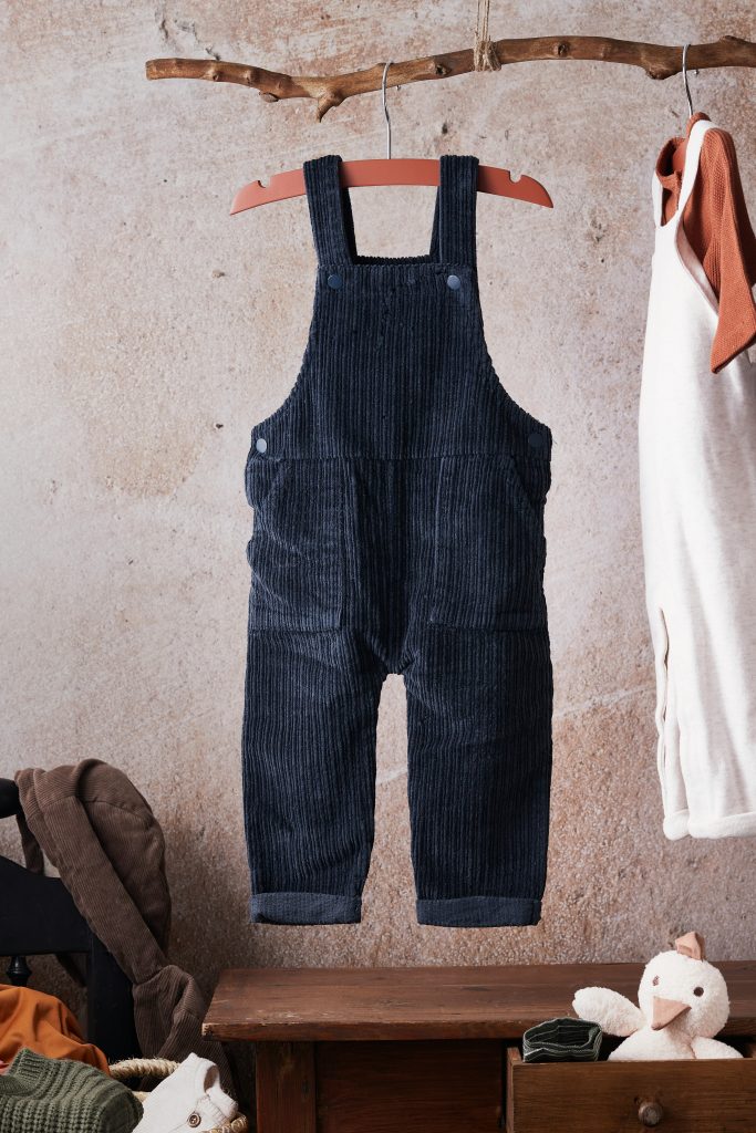Infant and children’s garment manufacturing using organic fabrics and ethical processes. Children’s overalls produced through infant and children’s garment manufacturing, reflecting ethical production practices, organic fabric sourcing, and compliant kidswear manufacturing.